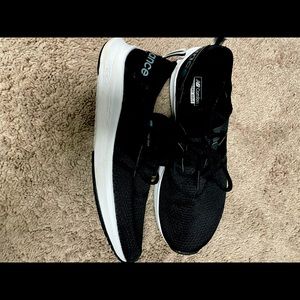 Black New Balance shoes. Size 10.